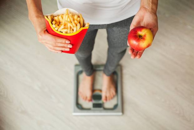 Choose between junk food versus healthy diet
