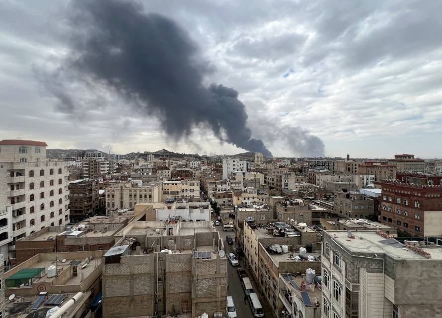 Smoke billows after an Israeli airstrike on Houthi infrastructure, in Sana'a