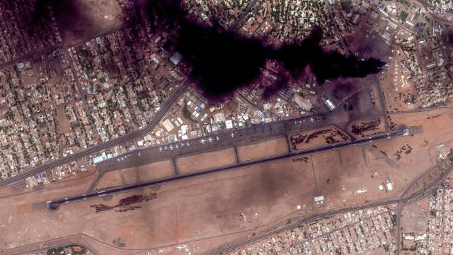 Satellite image shows smoke and an overview of Khartoum International Airport in Khartoum
