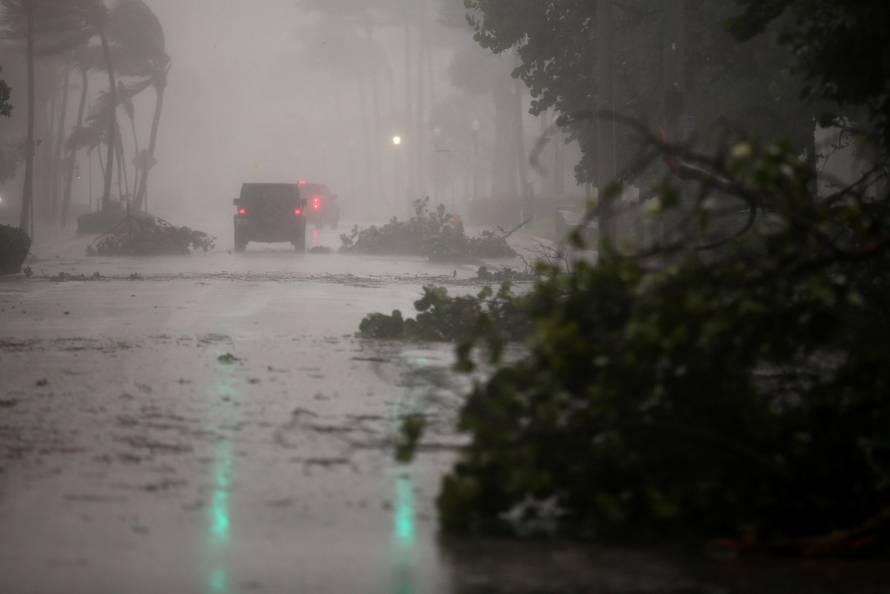 Vehicles drive along Ocean Drive in South Beach as Hurricane Irma arrives at south Florida, in Miami Beach, Florida