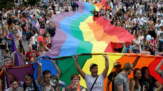 Participants hold a giant rainbow flag during the Prague Pride Parade where thousands marched through the city centre in support of gay rights, in Czech Republic