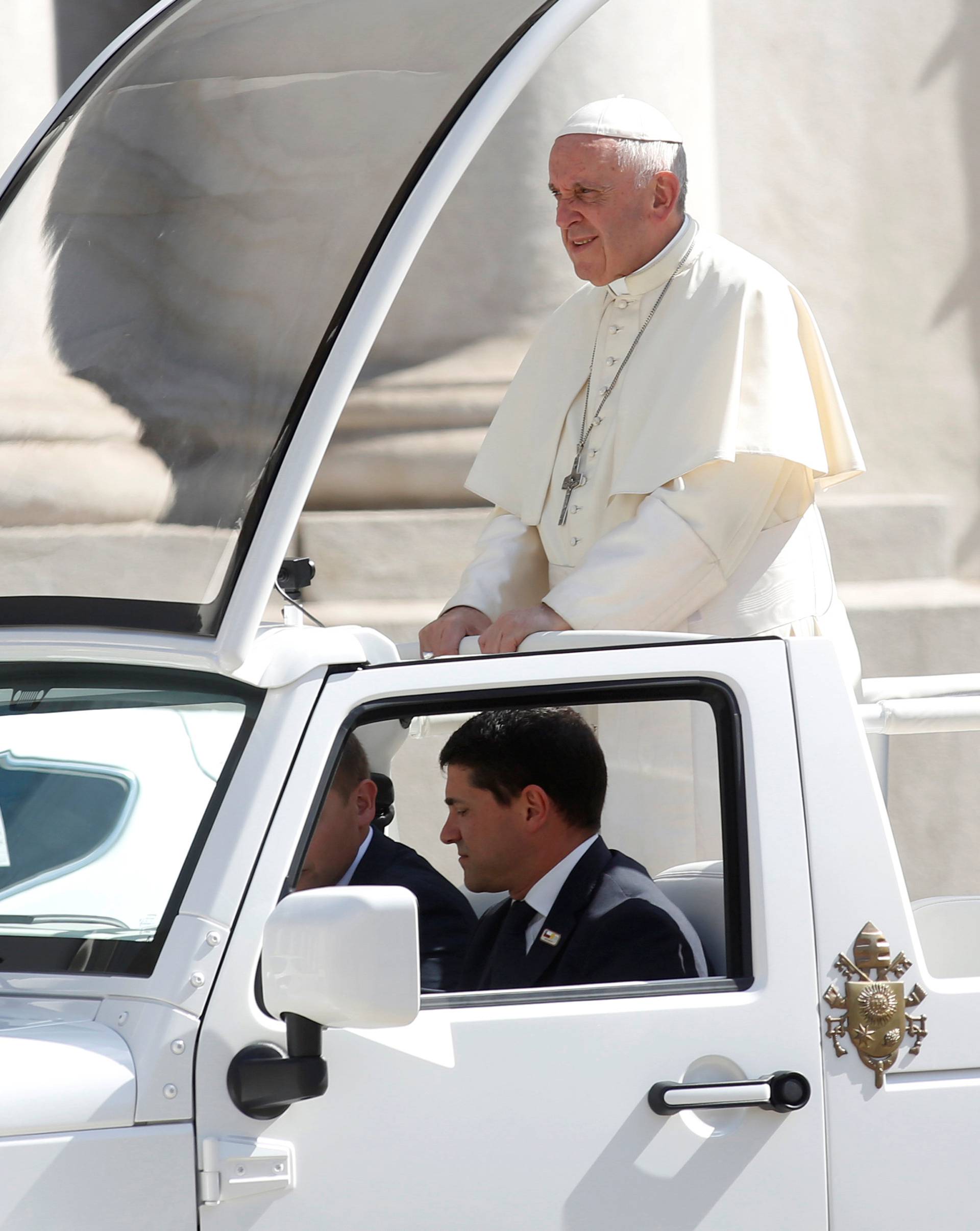 Pope Francis rides in the popemobile in Santiago