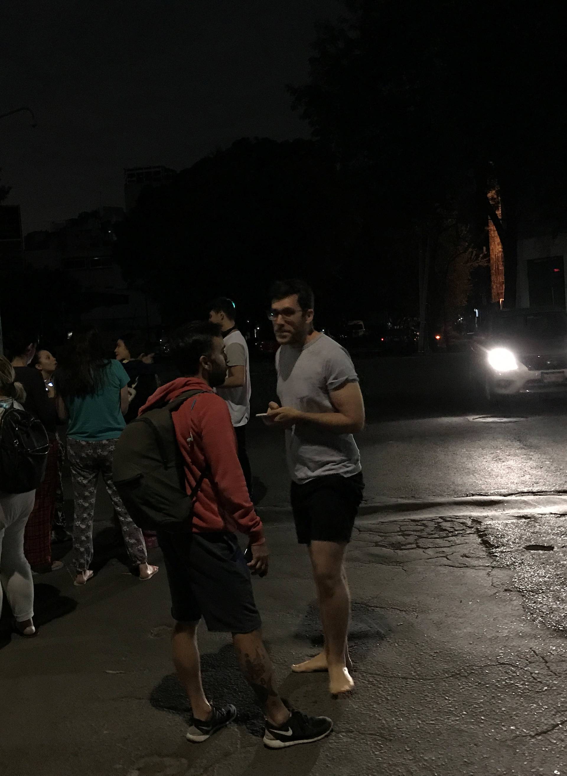 People gather on a street after an earthquake hit Mexico City