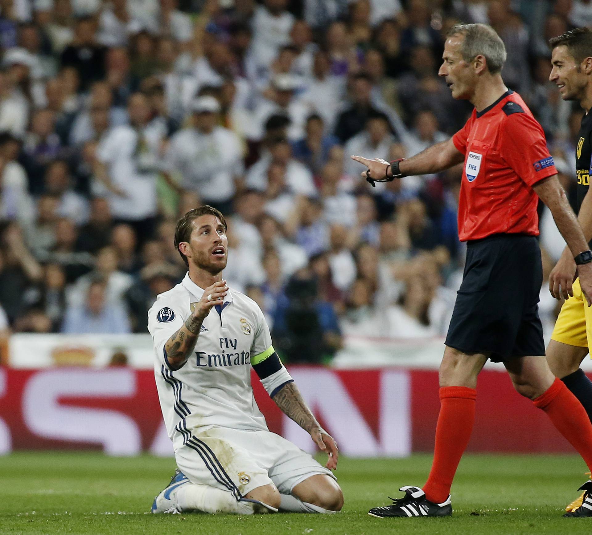 Real Madrid's Sergio Ramos gestures to referee Martin Atkinson