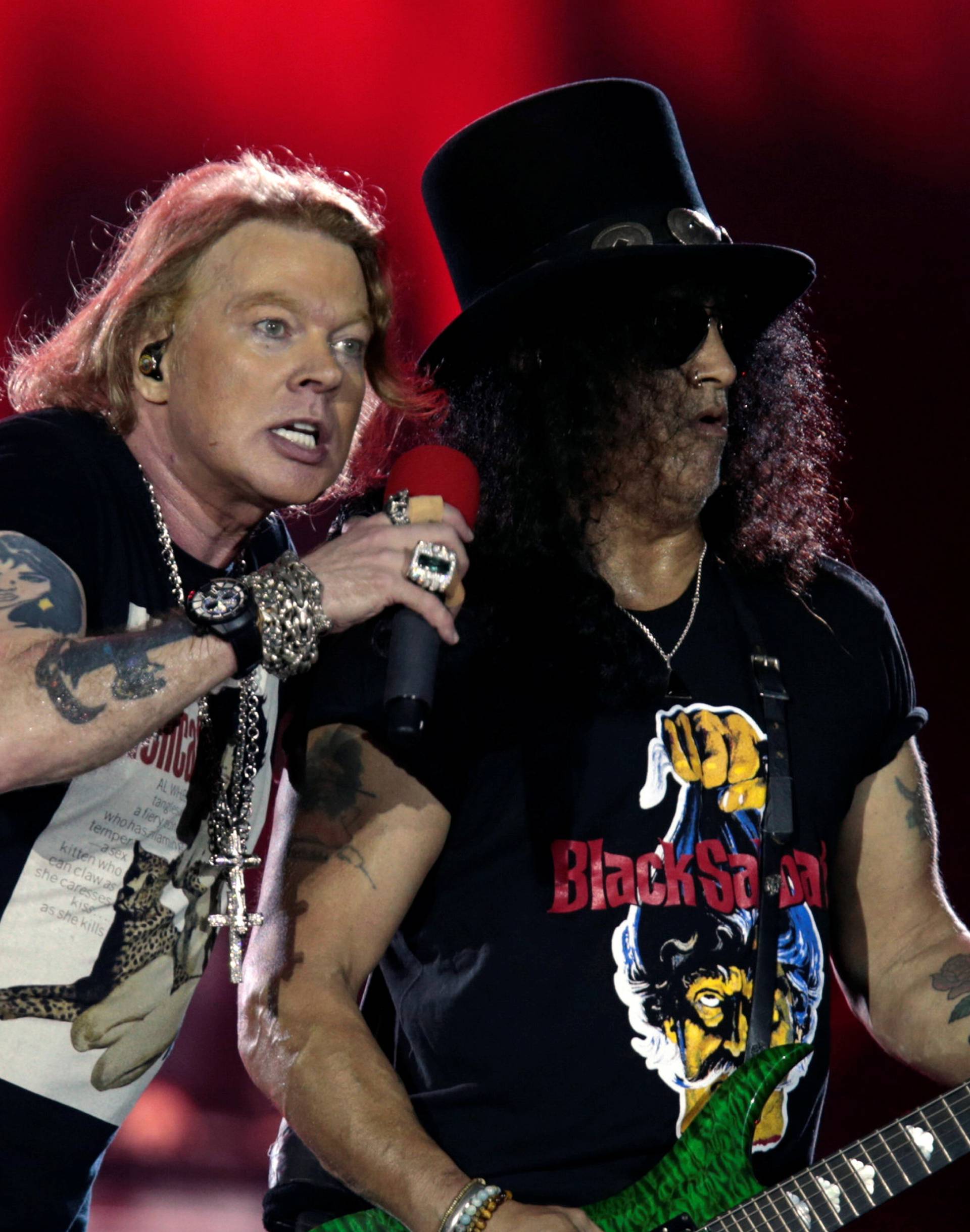Axl Rose and Slash, lead singer and lead guitarist of U.S. rock band Guns N' Roses, perform during their "Not in This Lifetime... Tour" at the du Arena in Abu Dhabi