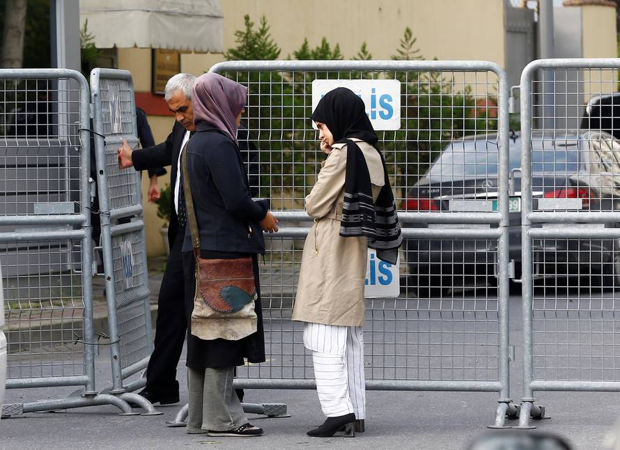 Fiancee of Saudi journalist Jamal Khashoggi and her friend wait outside Saudi Arabia's consulate in Istanbul