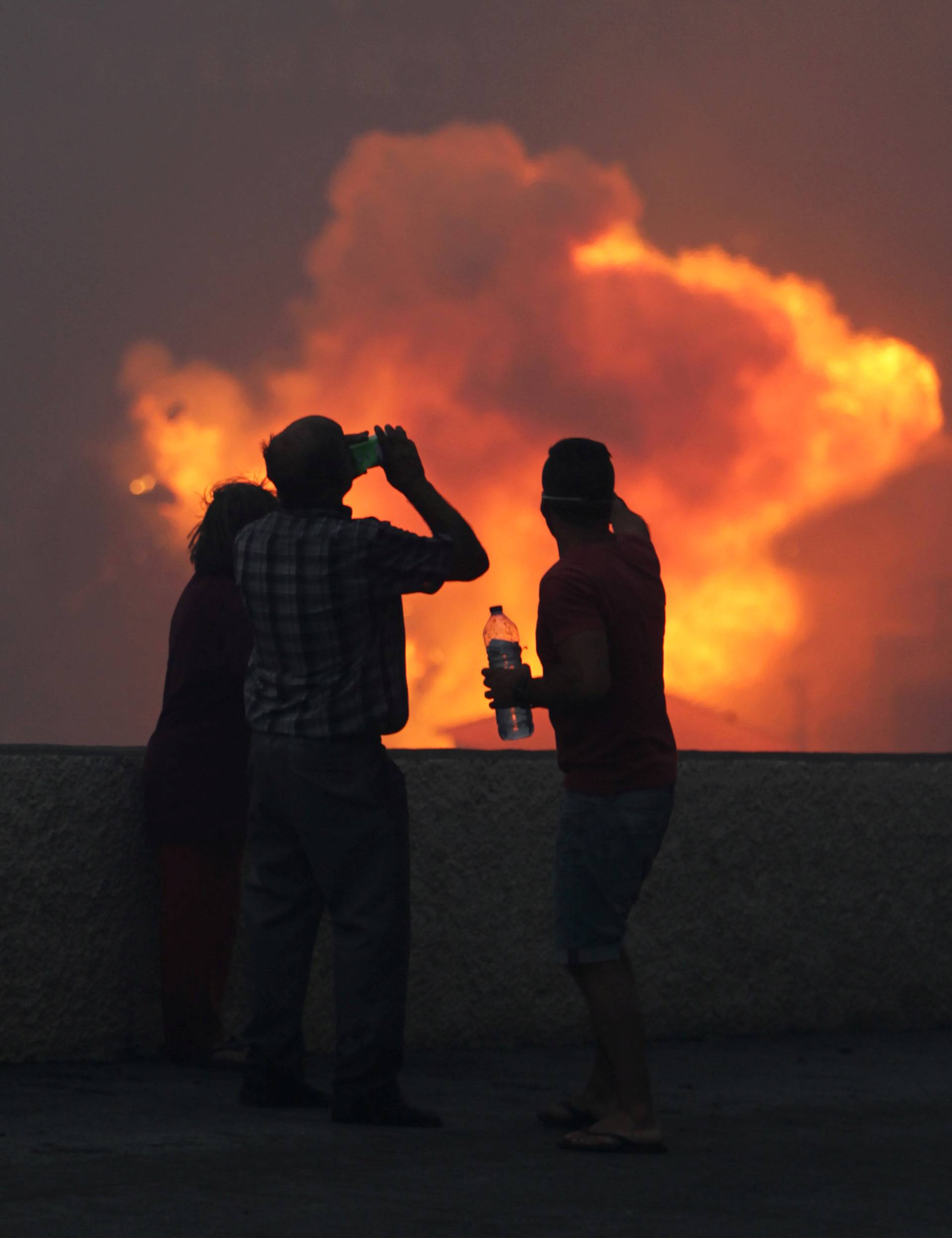 People watch the wildfires at Funchal, Madeira island, Portugal