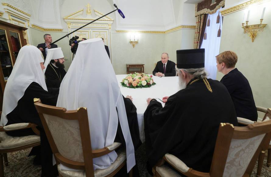Russian President Vladimir Putin welcomes Serbian Patriarch Porfirije in Moscow