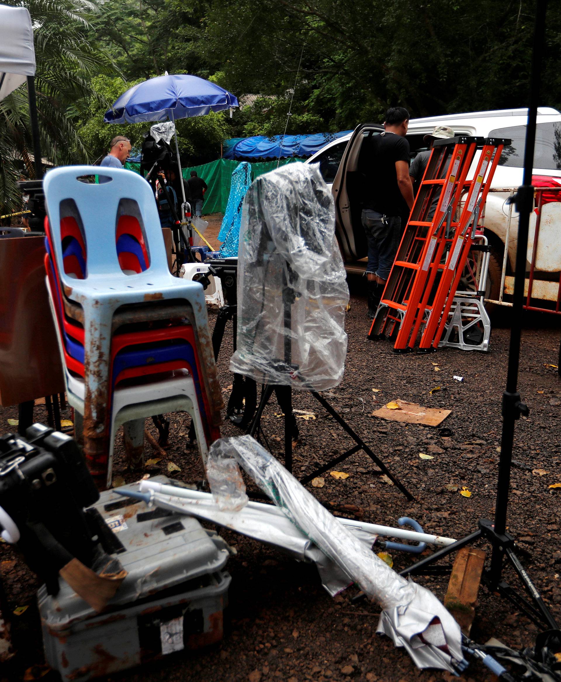 Journalists pack up to leave the site of the Tham Luang cave complex after Thailand's government instructed members of the media to move out urgently, in the northern province of Chiang Rai