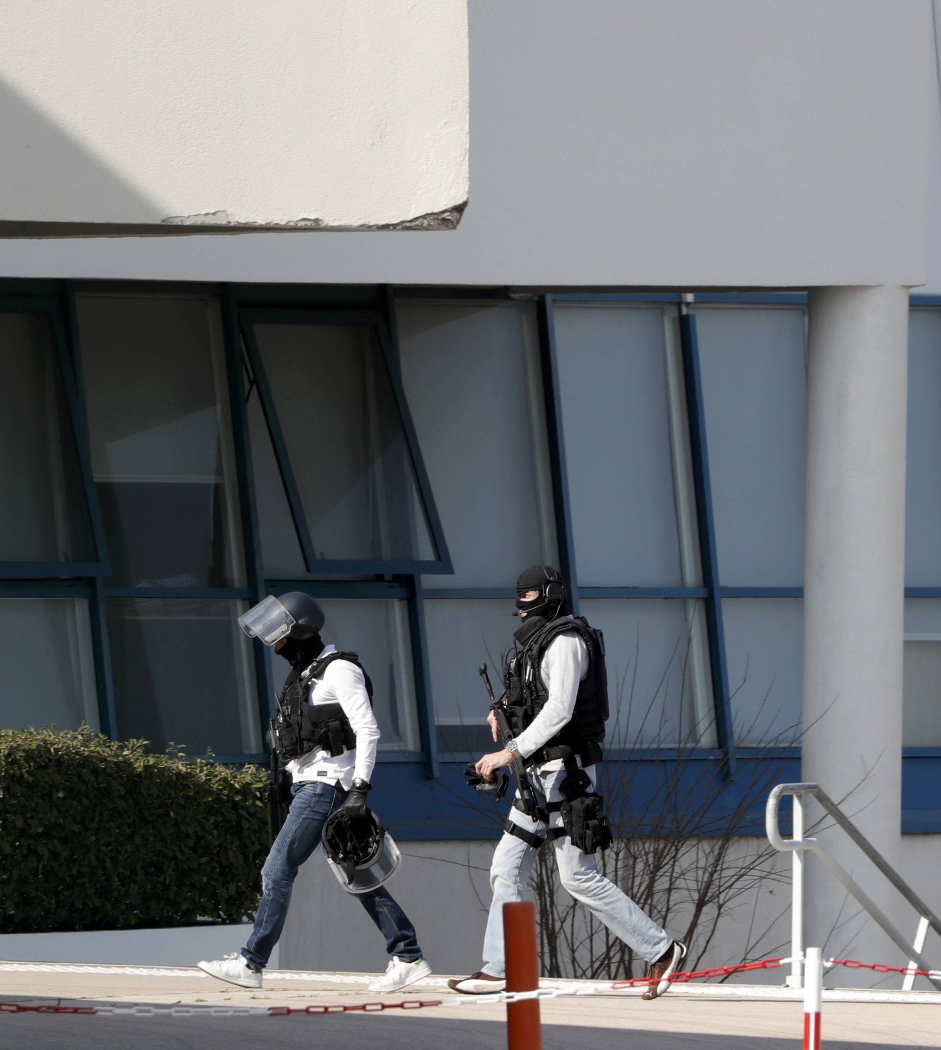 Police inside the Tocqueville high school after a shooting took place injuring at least eight people, in Grasse