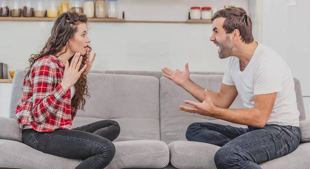 Negative emotions are a couple of concepts. A husband and wife, asserting and shouting expressive and emotional pairs having an argument or quarrel at home.