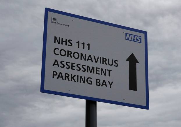 Signage directing patients towards a Coronavirus assessment bay is seen outside Whiston Hospital in Liverpool