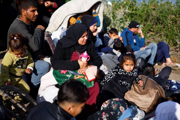 Displaced Palestinians wait to be allowed to return to their homes in northern Gaza, in the central Gaza Strip