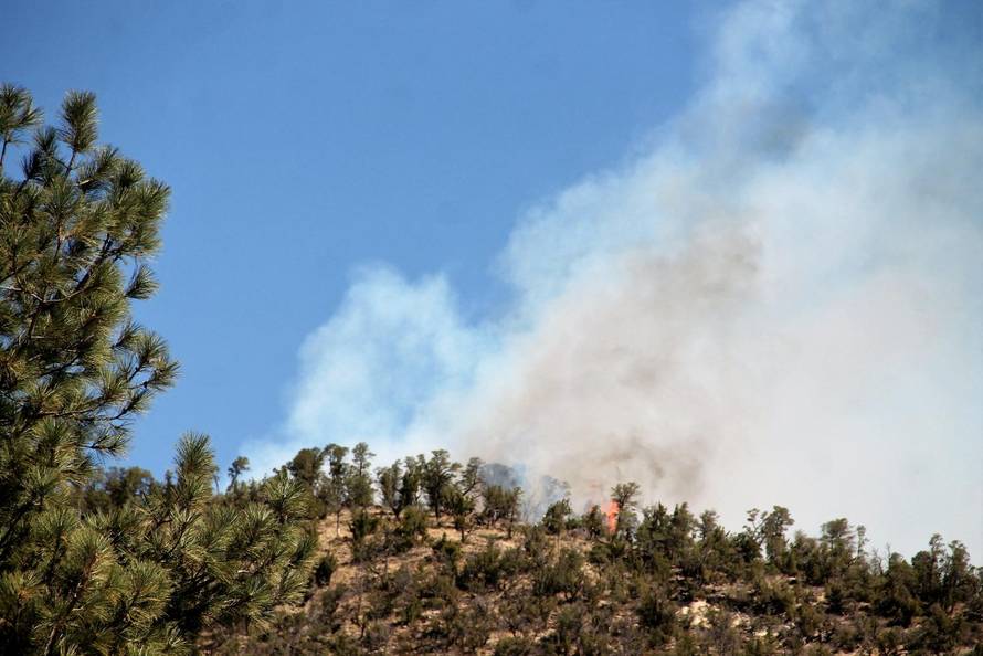 Smoke rises from the McBride Fire as seen from the Ruidoso Community Center