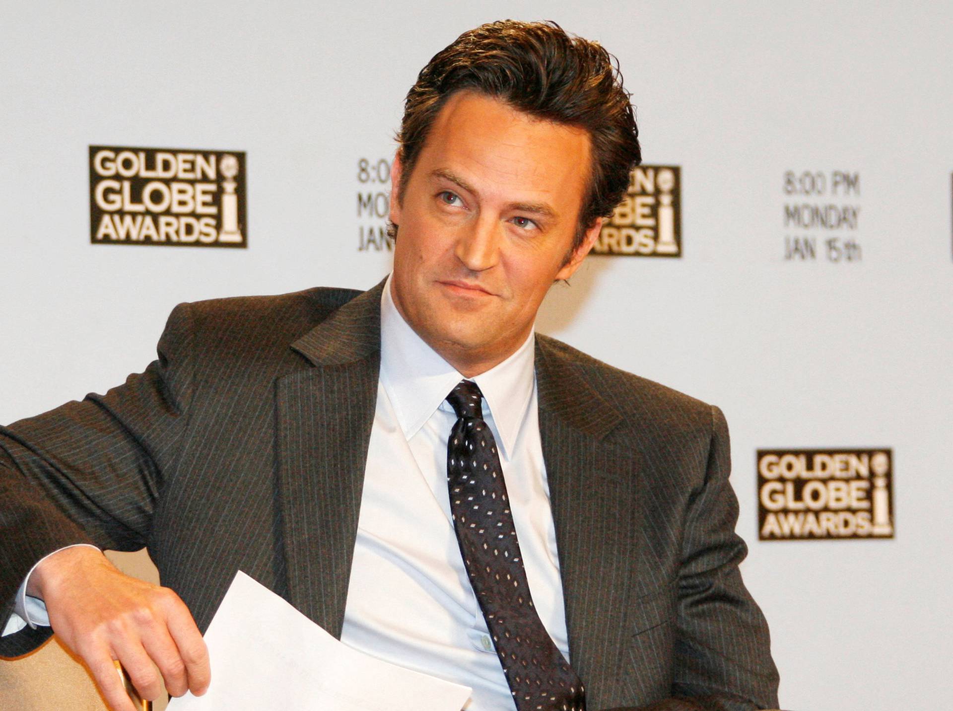 FILE PHOTO: Actor Matthew Perry waits to announce nominations at Golden Globes news conference in Beverly Hills