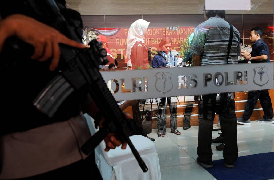 Colleagues of victims of the Lion Air flight JT610 crash are seen at a police hospital in Jakarta
