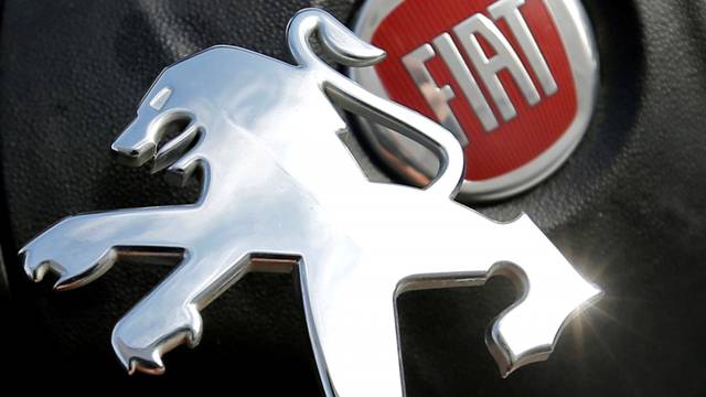FILE PHOTO: Logos of Peugeot and Fiat are seen in this illustration picture