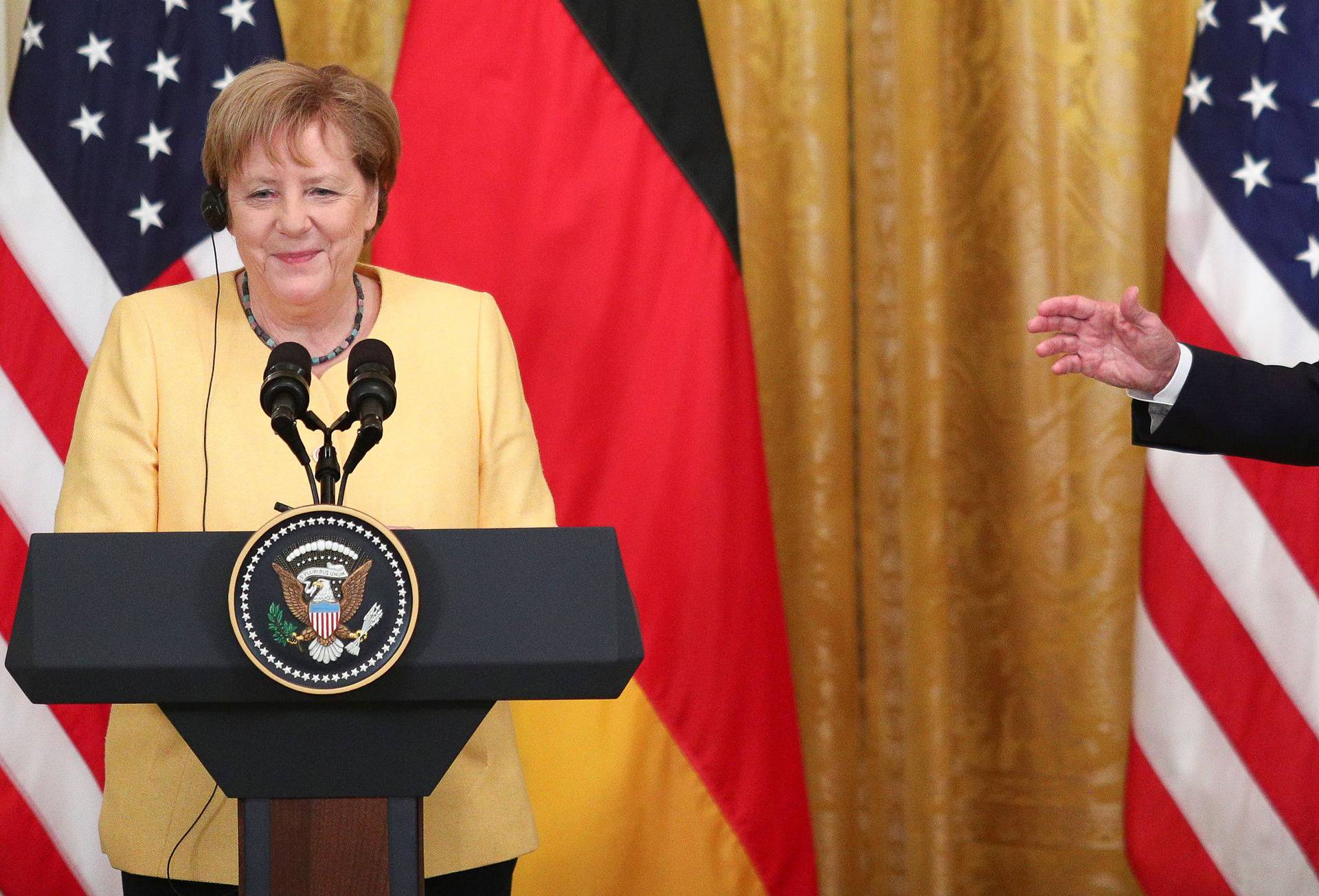 U.S. President Joe Biden and German Chancellor Angela Merkel attend a joint news conference in the East Room at the White House