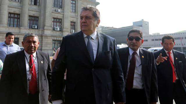 FILE PHOTO: Former Peruvian president Alan Garcia talks to the media as he arrives at the National Prosecution office in Lima