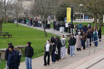 Students queuing for antibiotics outside a building at the University of Kent in Canterbury. The university have confirmed that a student was one of two people who have died as a result of meningitis in the area. The UK Health Security Agency (UKHSA) said