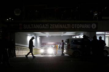 Turkish police officers stand guard outside a car park where a vehicle belonging to Saudi Arabia's consulate was found, in Istanbul