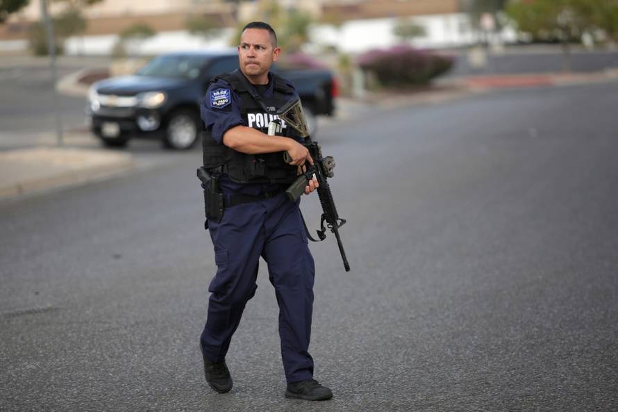 A police officer is seen after a mass shooting at a Walmart in El Paso