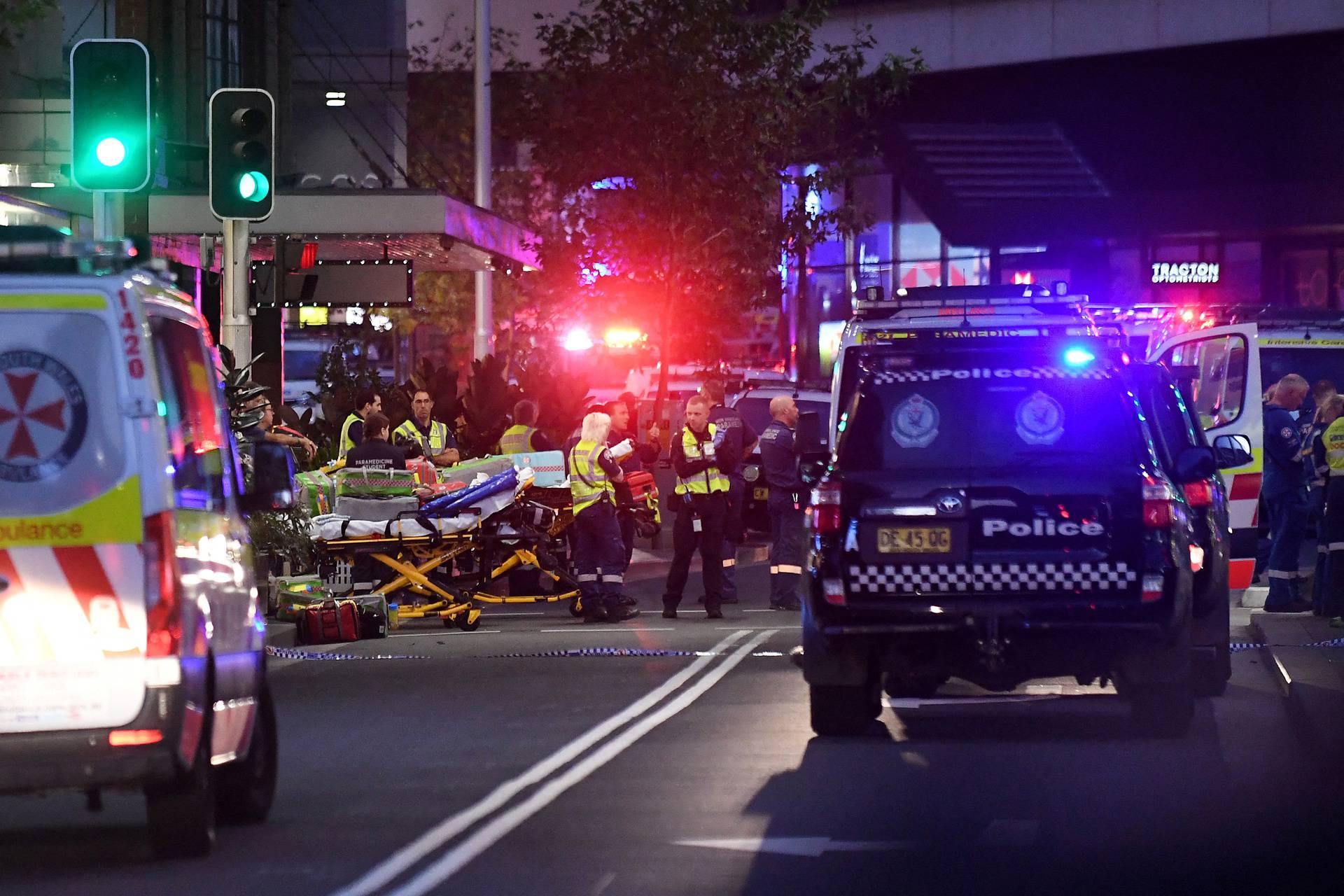Emergency service workers are seen near Bondi Junction after multiple people were stabbed inside the Westfield Bondi Junction shopping centre in Sydney