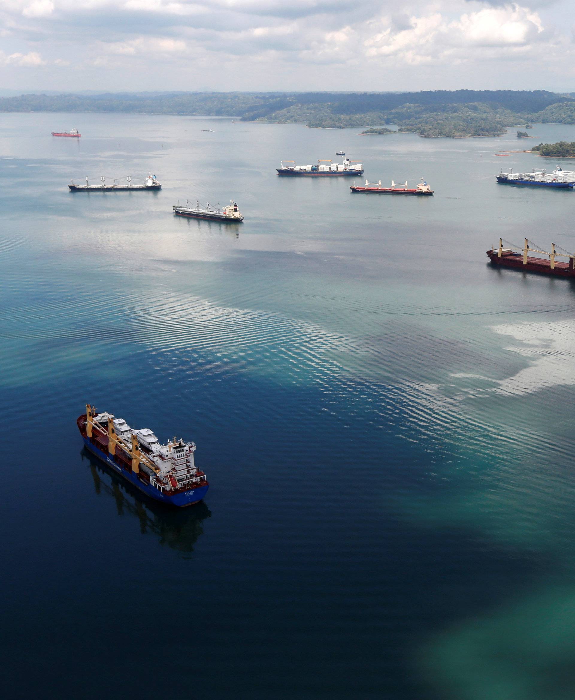 Cargo ships navigate Panama Canal during organized media tour by Italy's Salini Impregilo, on the outskirts of Colon city, Panama