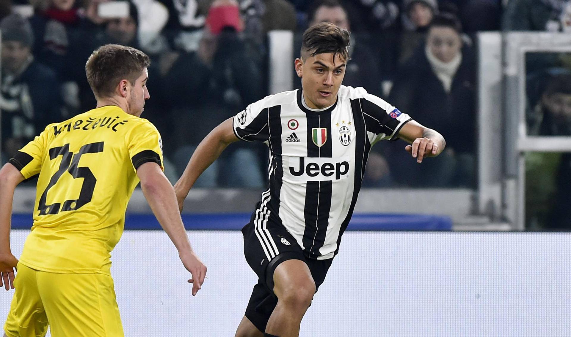 Juventus' Paulo Dybala in action with Dinamo Zagreb's Bojan Knezevic