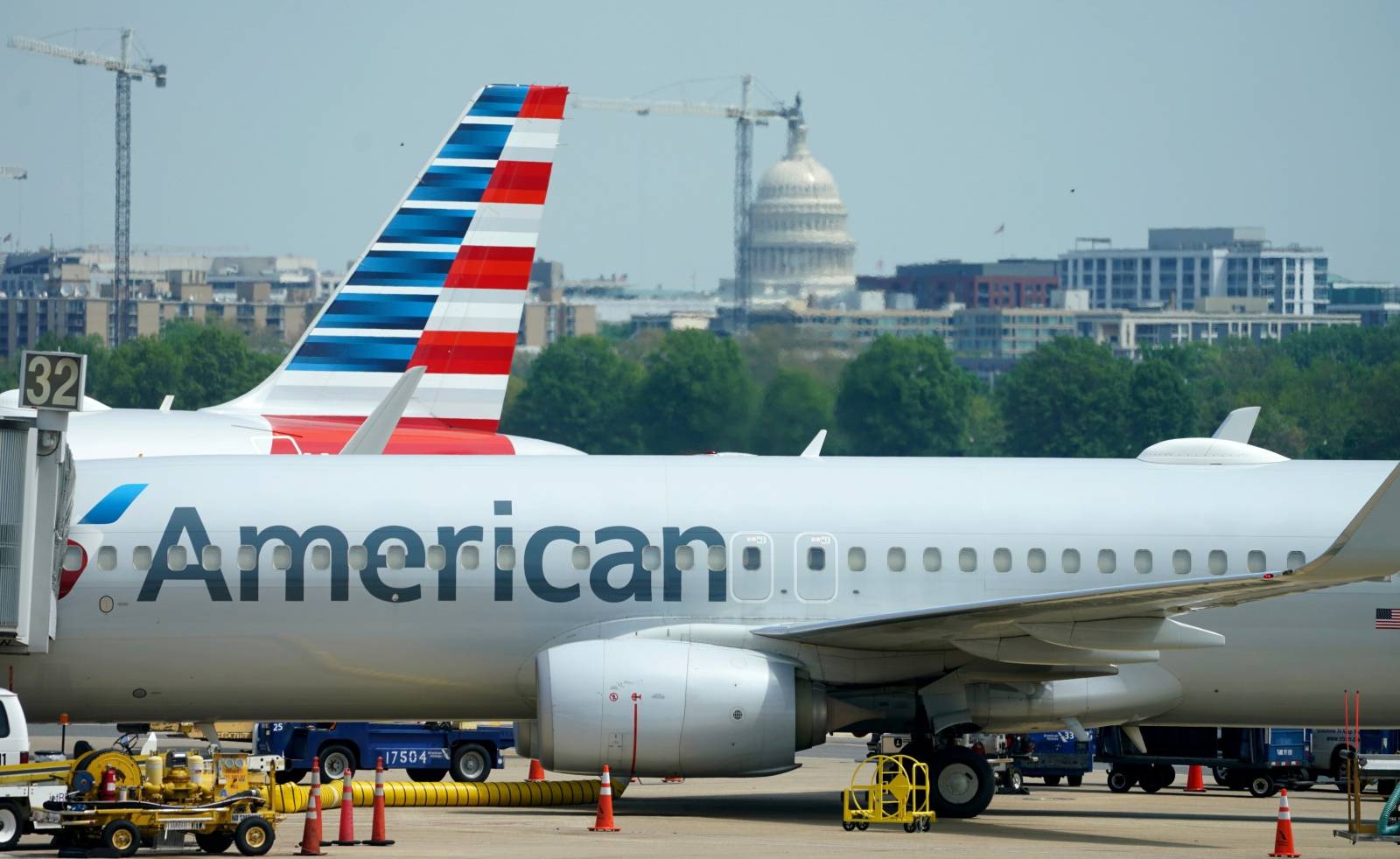 Boeing 737-800 jet sits at a gate at Washington's Reagan National airport with U.S. Capitol building in the background in Washington