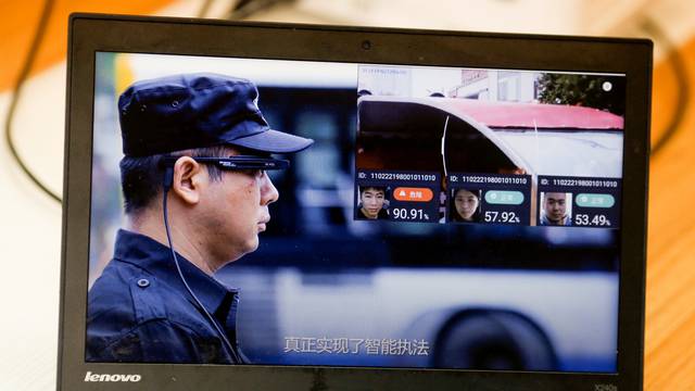 A promotion video shows an actor wearing LLVision facial recognition smart glasses during a demonstration at the company's office in Beijing