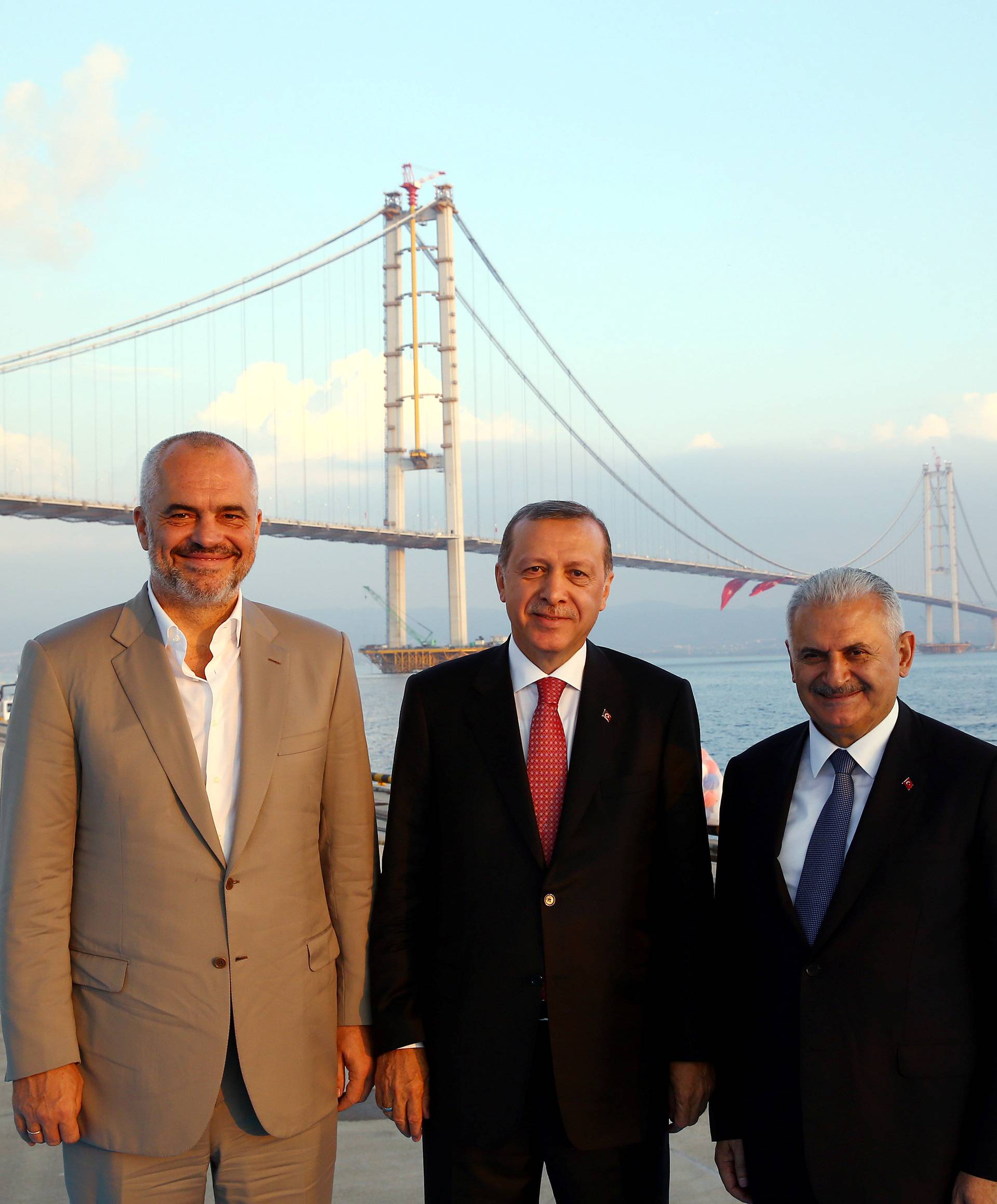 Turkish President Tayyip Erdogan poses with Turkish Prime Minister Binali Yildirim and his Albanian counterpart Edi Rama during the opening ceremony of Osman Gazi bridge in Kocaeli