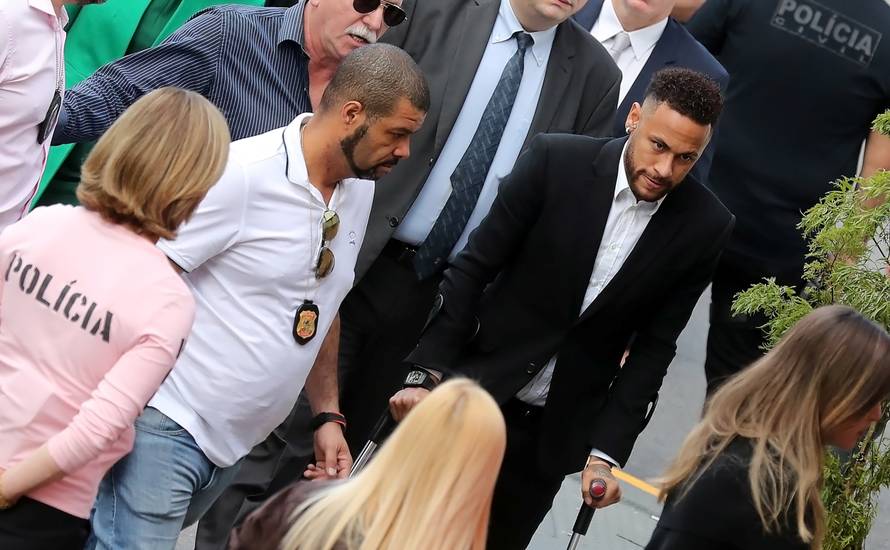 Brazilian soccer player Neymar arrives at a police station in Sao Paulo