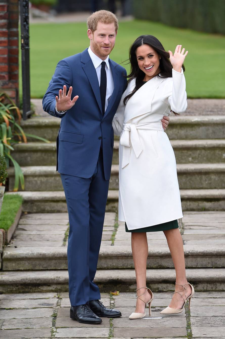 FILE PHOTO: Britain's Prince Harry poses with Meghan Markle in the Sunken Garden of Kensington Palace, London