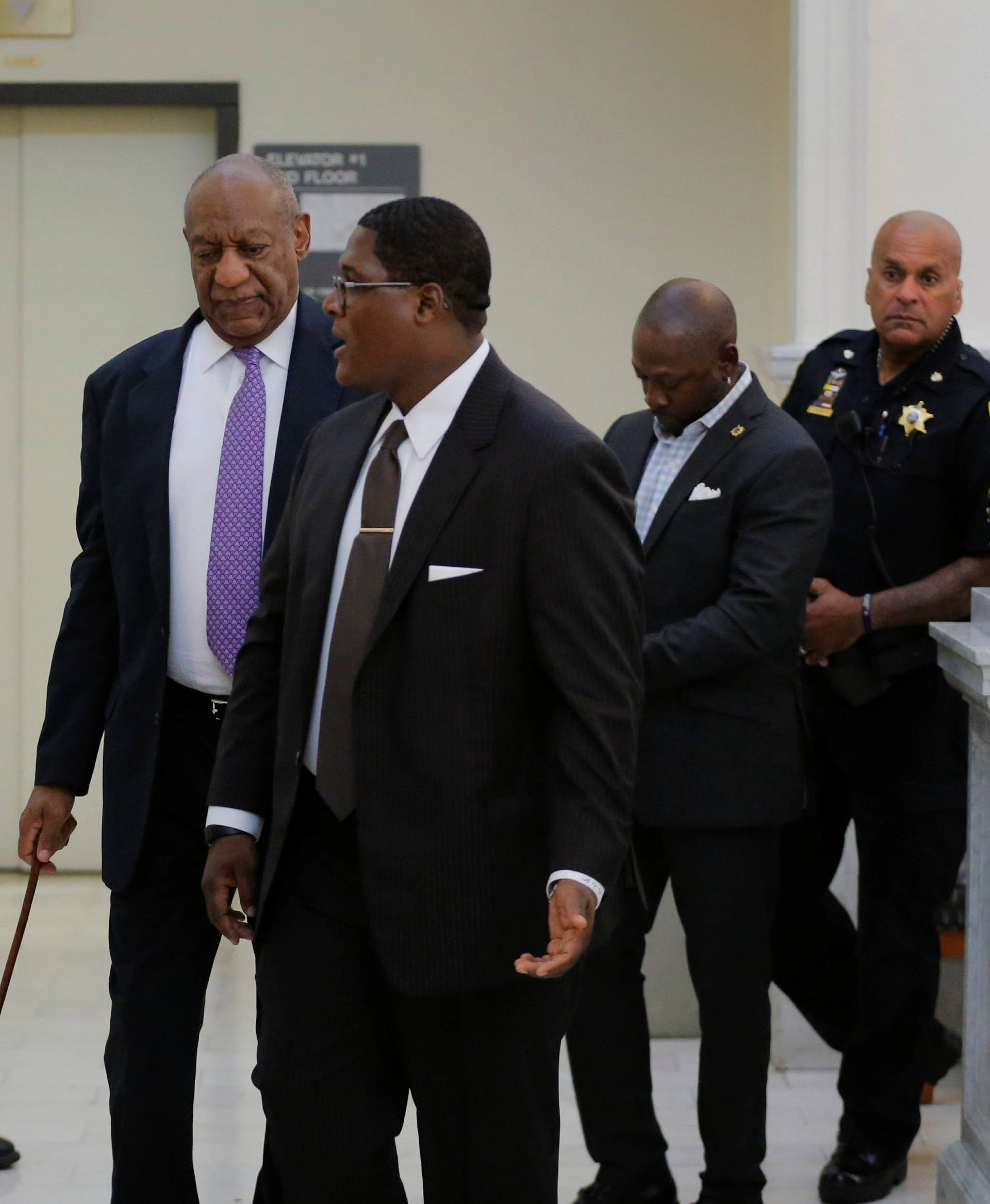 Cosby walks back into the courtroom after trial break in Norristown