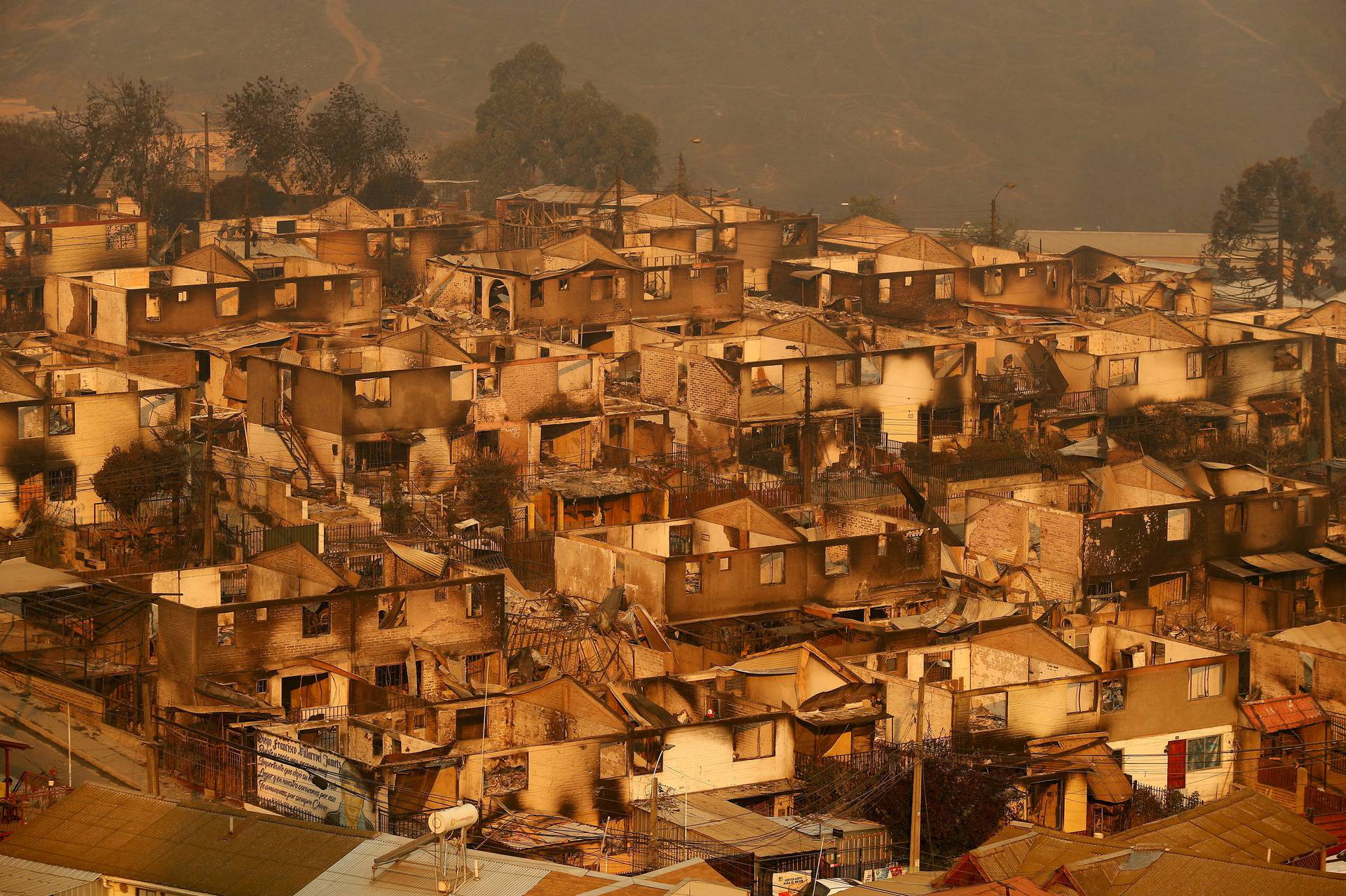 Burnt houses are pictured amid the spread of wildfires in Vina del Mar