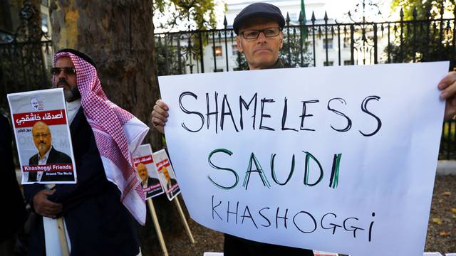 People protest against the killing of journalist Jamal Khashoggi in Turkey outside the Saudi Arabian Embassy in London