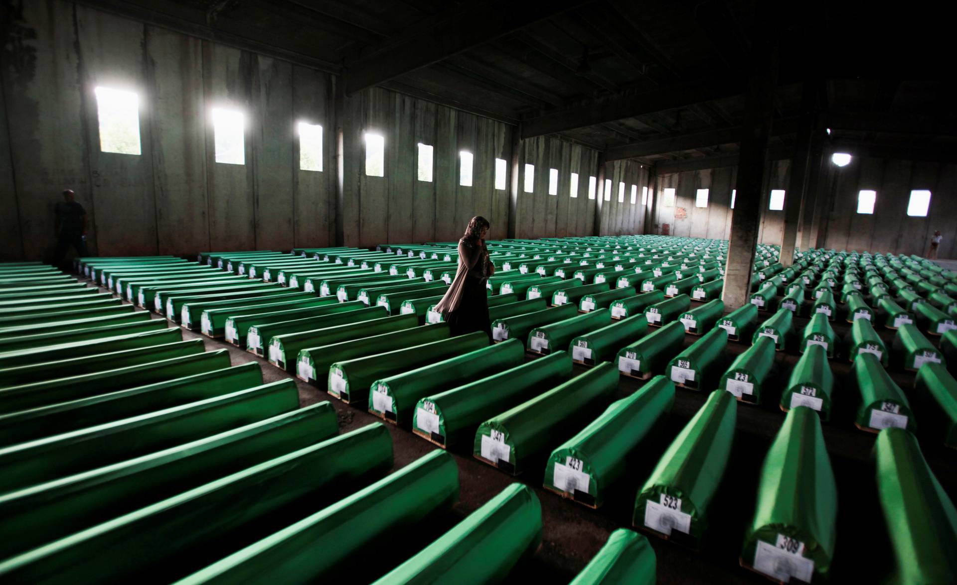 FILE PHOTO: Bosnian Muslim woman searches coffins in Potocari