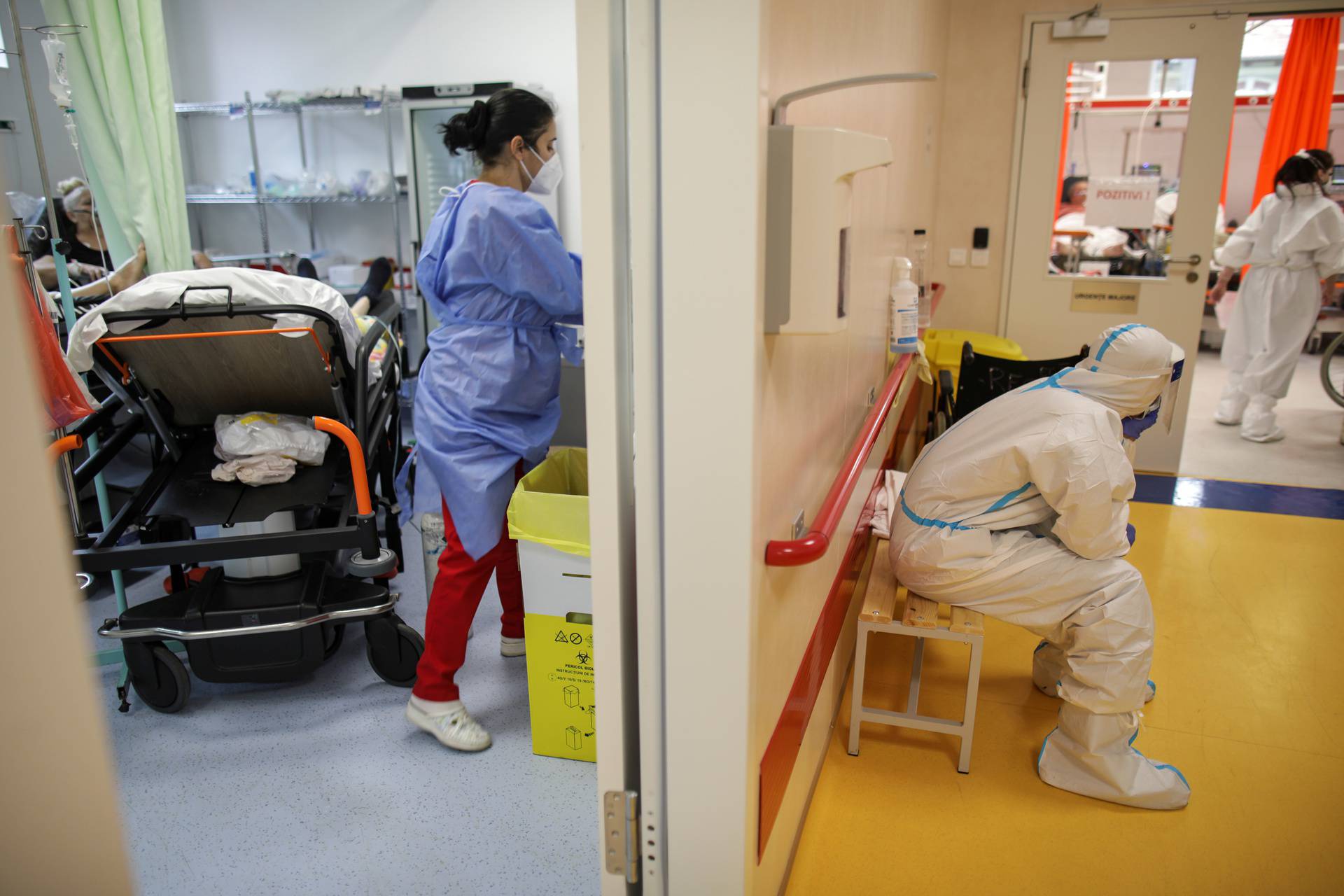 Medical professionals assist coronavirus disease (COVID-19) patients in the overcrowded intensive care unit