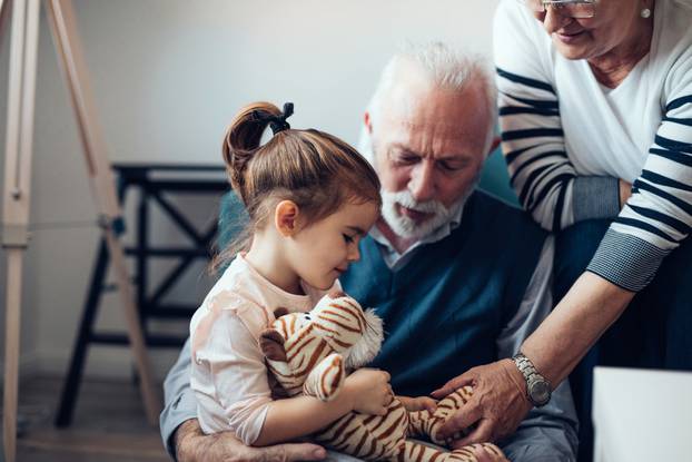 Grandparents,Playing,With,Their,Granddaughter