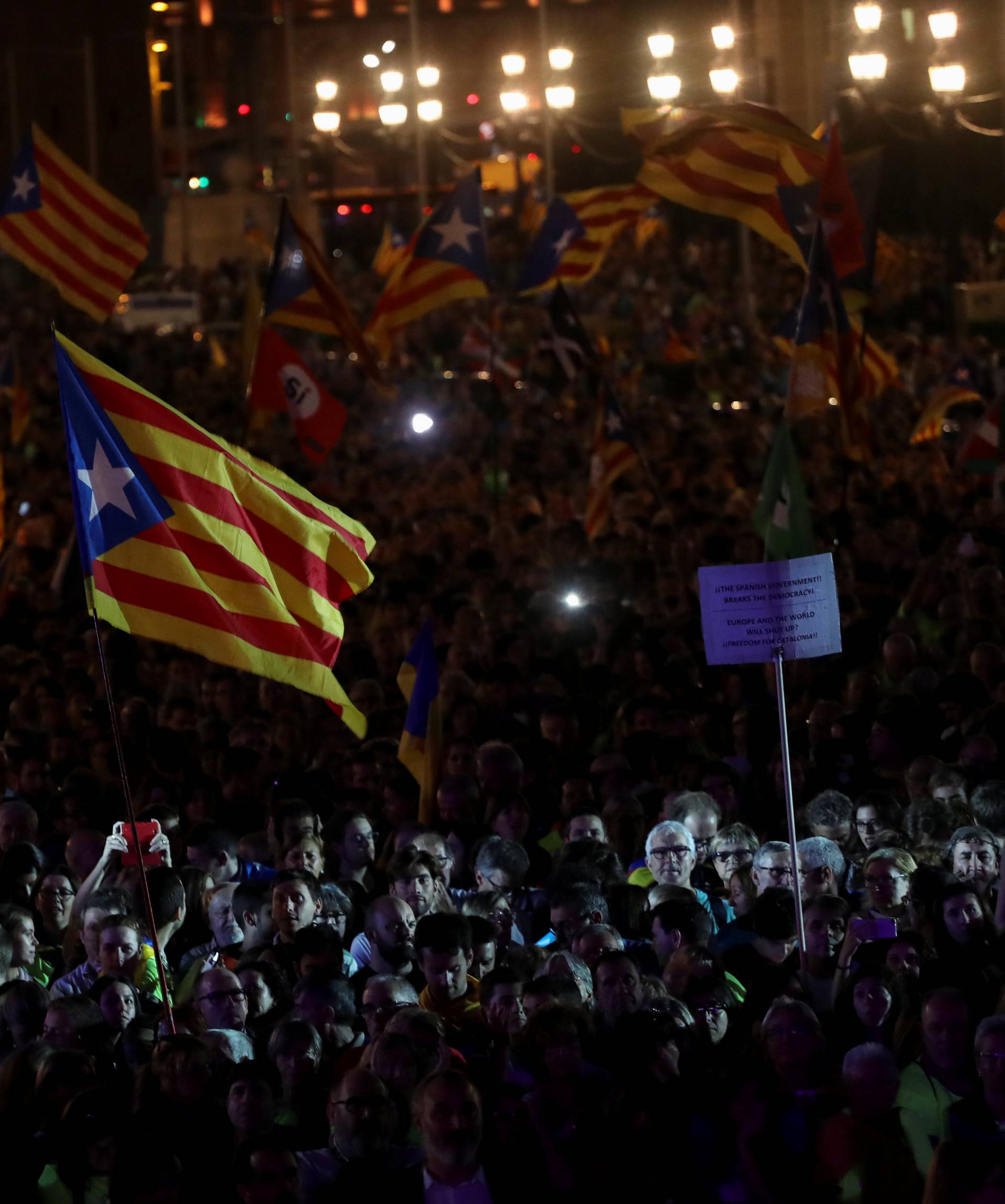 People attend a closing rally in favour of the banned October 1 independence referendum in Barcelona