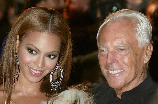 FILE PHOTO: R & B solo artist Beyonce Knowles (L) of the U.S. and Italian fashion designer Giorgio Armani arrive..
