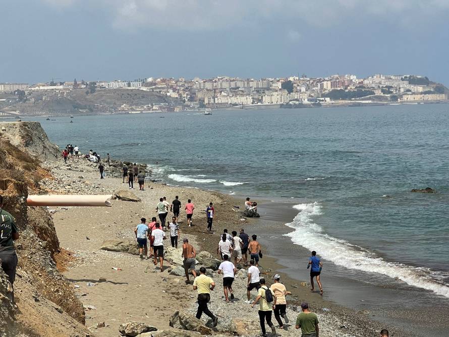 Migrants cross on foot into North African enclave of Ceuta from Morocco