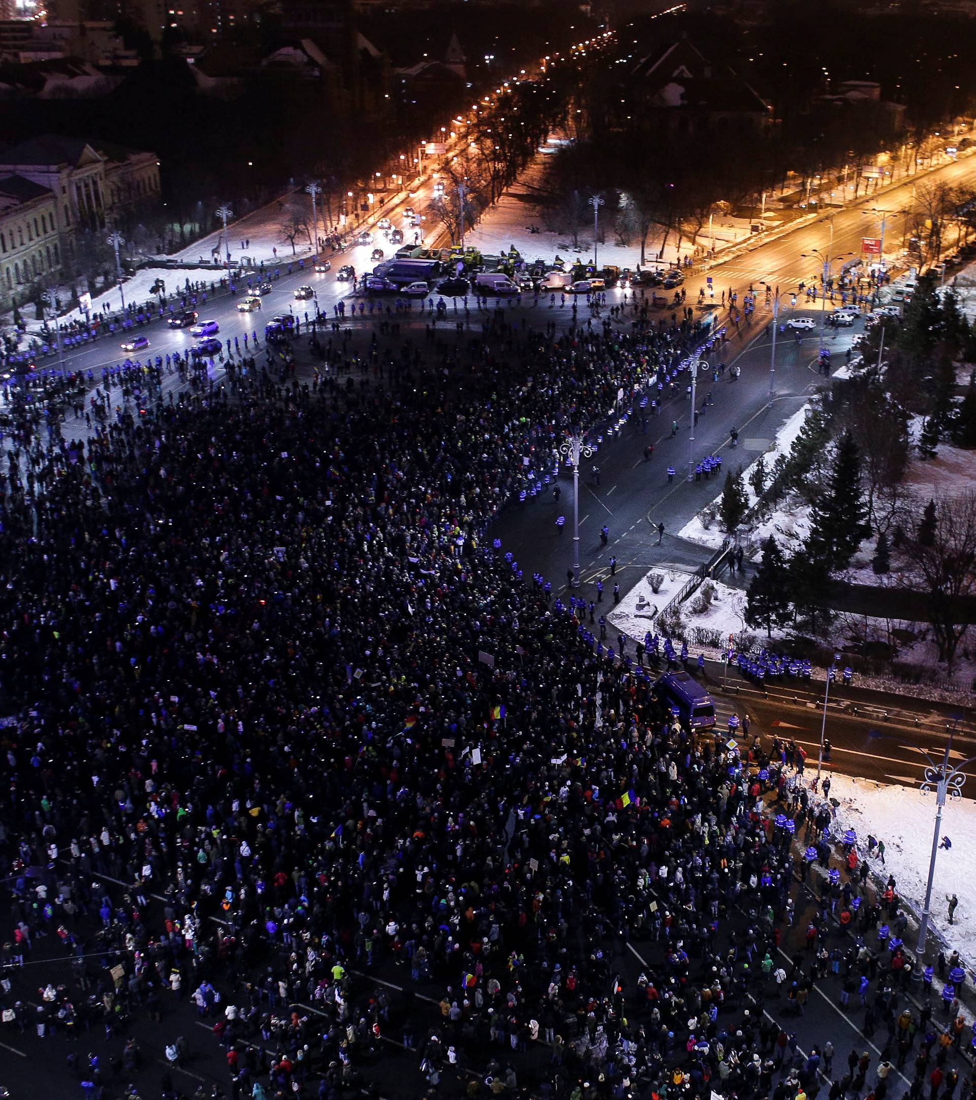 People take part in a demonstration to protest against government plans to reform some criminal laws through emergency decree, in Bucharest