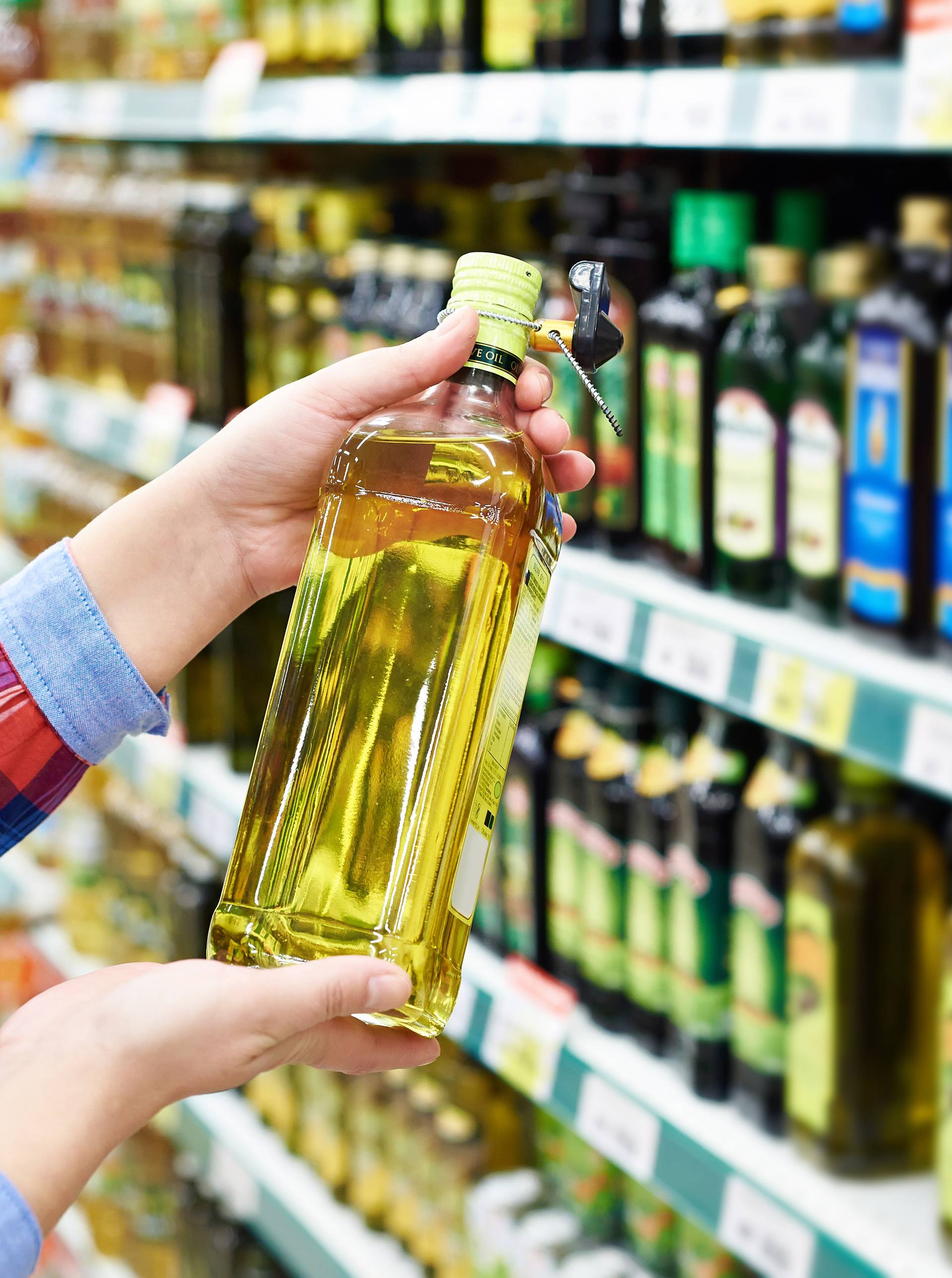 Buyer with sunflower oil in store