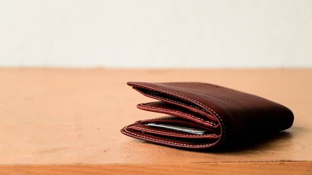 Brown,Leather,Wallet,Put,On,Wooden,Table,Top