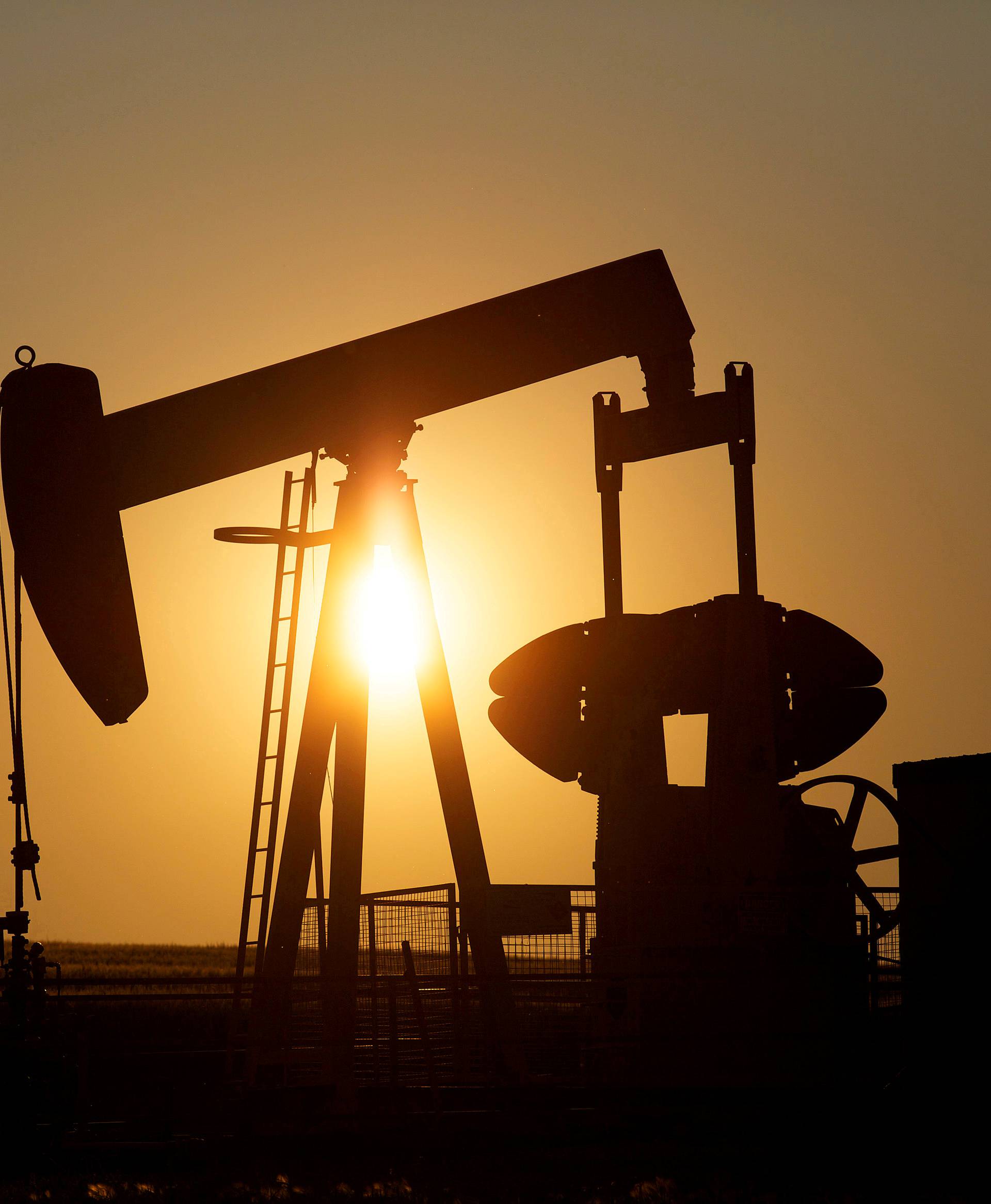 FILE PHOTO: An oil pump jack pumps oil in a field near Calgary