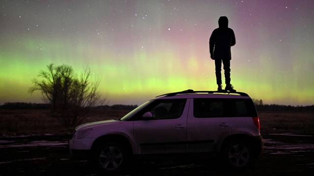 Auroras, caused by a coronal mass ejection on the Sun, illuminate the skies in Omsk region