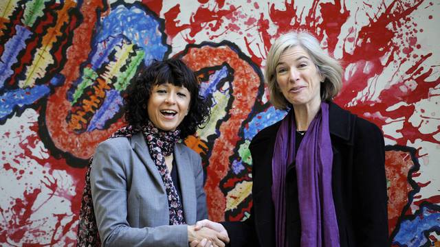 FILE PHOTO: French microbiologist Emmanuelle Charpentier (L) and professor Jennifer Doudna of the U.S. pose for the media during a visit to a painting exhibition by children about the genome, at the San Francisco park in Oviedo