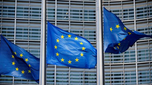 European Union flags fly outside the European Commission headquarters in Brussels